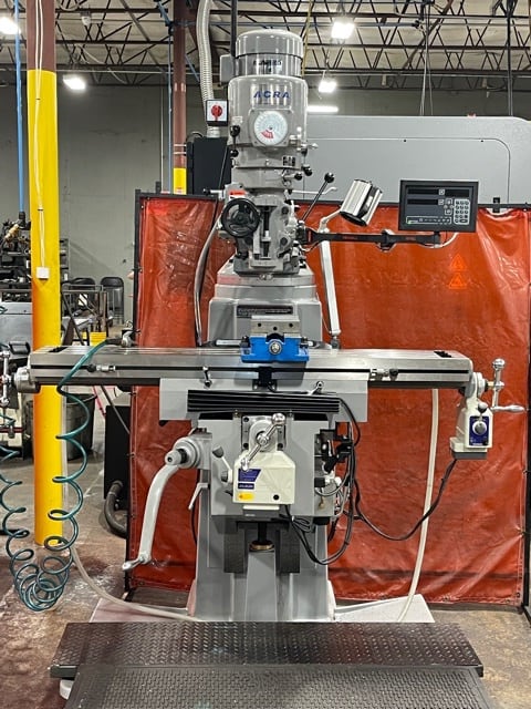 Manual milling machine set up for a machining job
