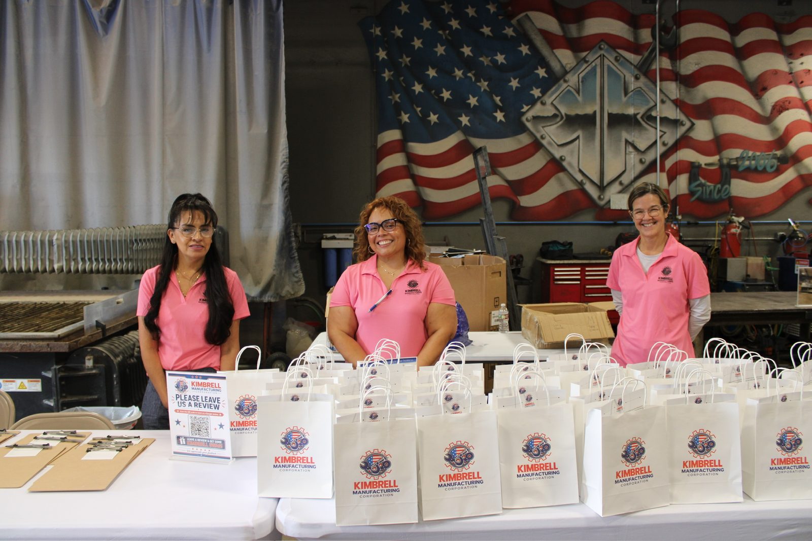 Kimbrell team members at the check-in table with gift bags