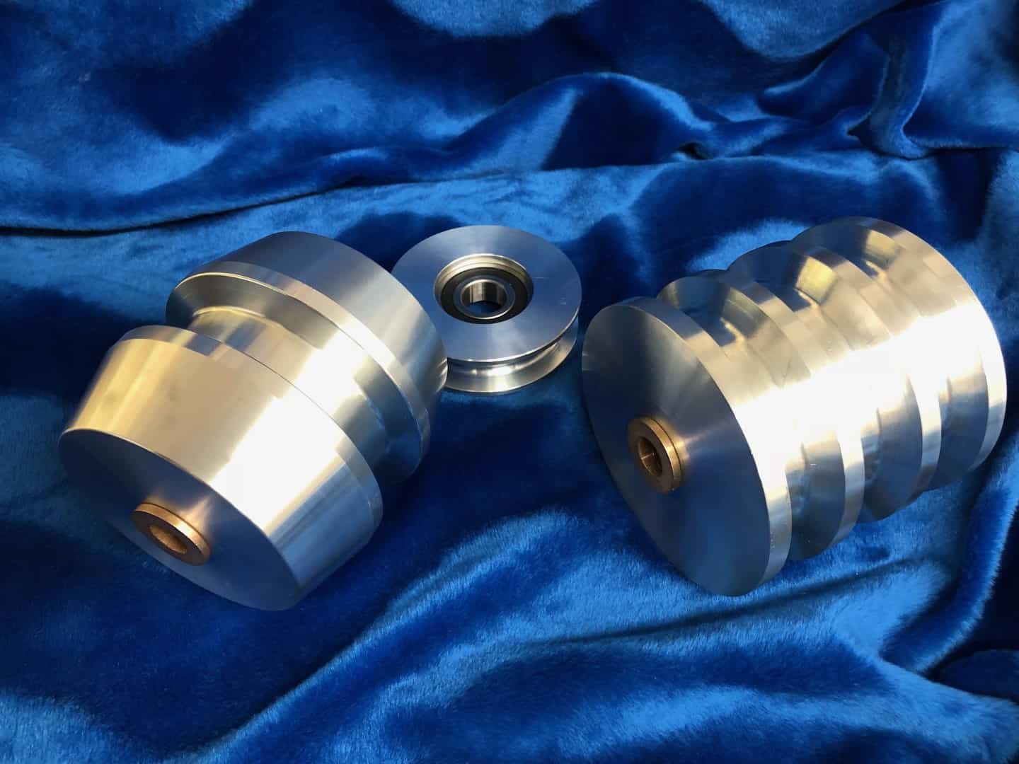 Precision-machined aluminum pulleys and bushings