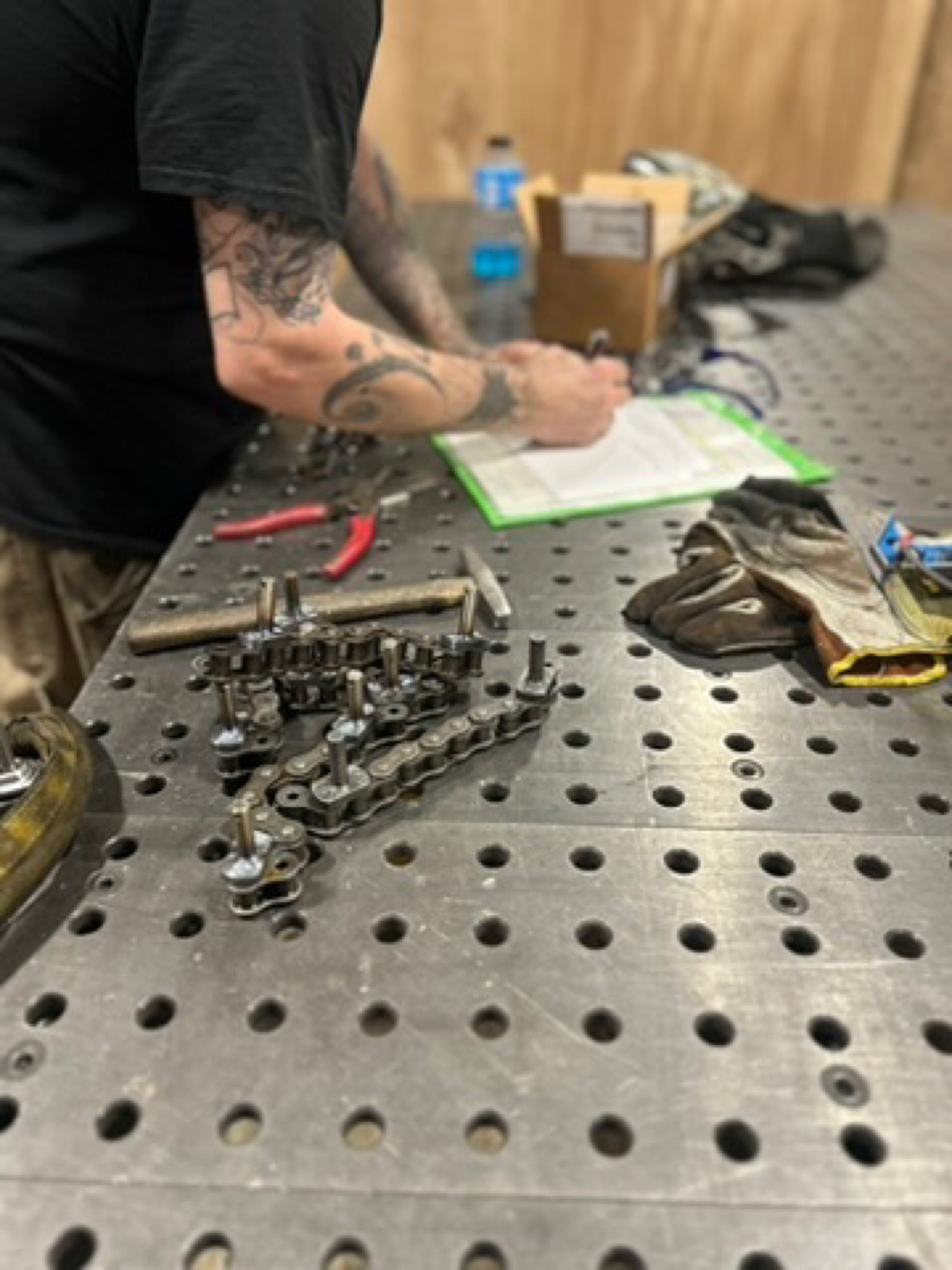 Kimbrell Manufacturing Corporation fabricator checking a component build against an inspection sheet