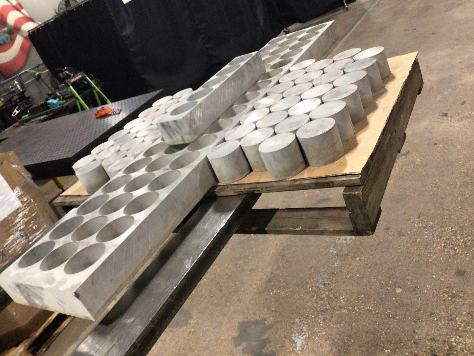 Round metal bar stock cut and staged on a pallet at Kimbrell Manufacturing Corporation