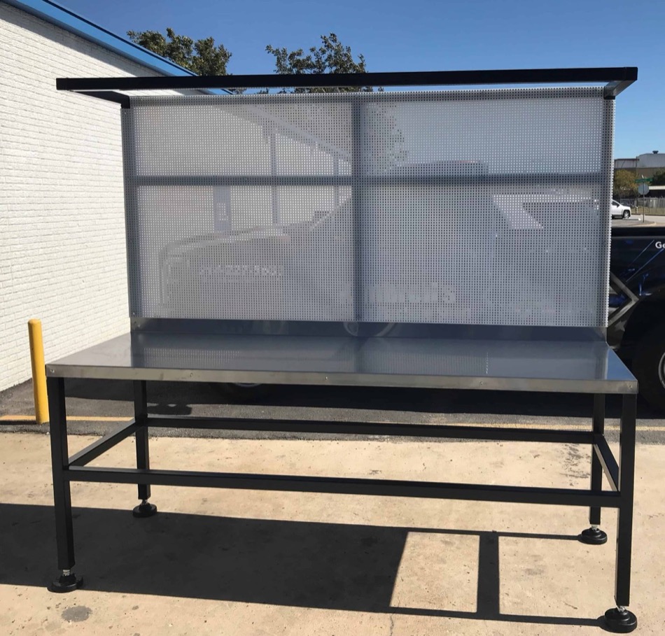 Fabricated stainless-top shop table with perforated tool storage frame