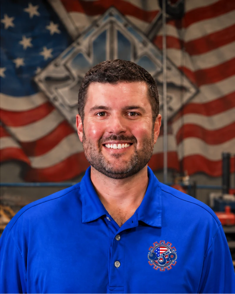 Austin Barrett, Owner and Steward, in front of the Kimbrell shop mural