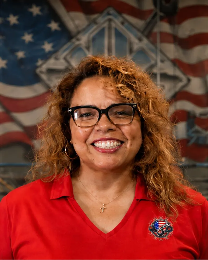 Yessenia Mata, Office Manager, in front of the Kimbrell shop mural